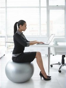 working woman on yoga ball chair